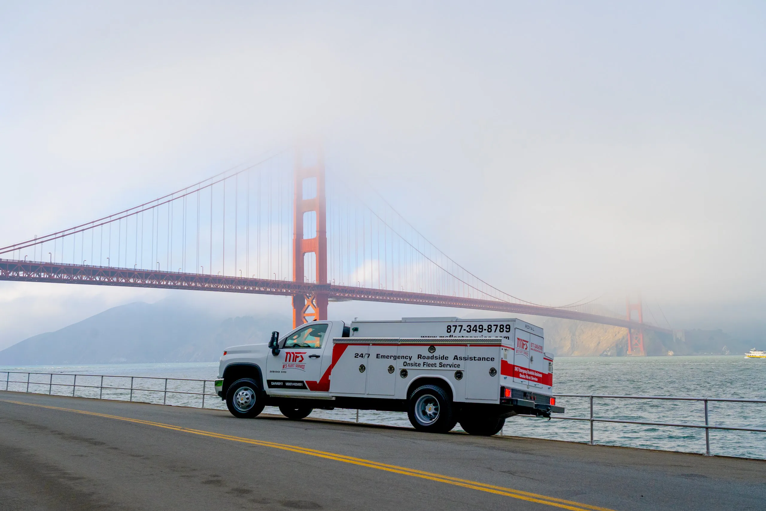 MFS Fleet Service truck beside the Golden Gate Bridge