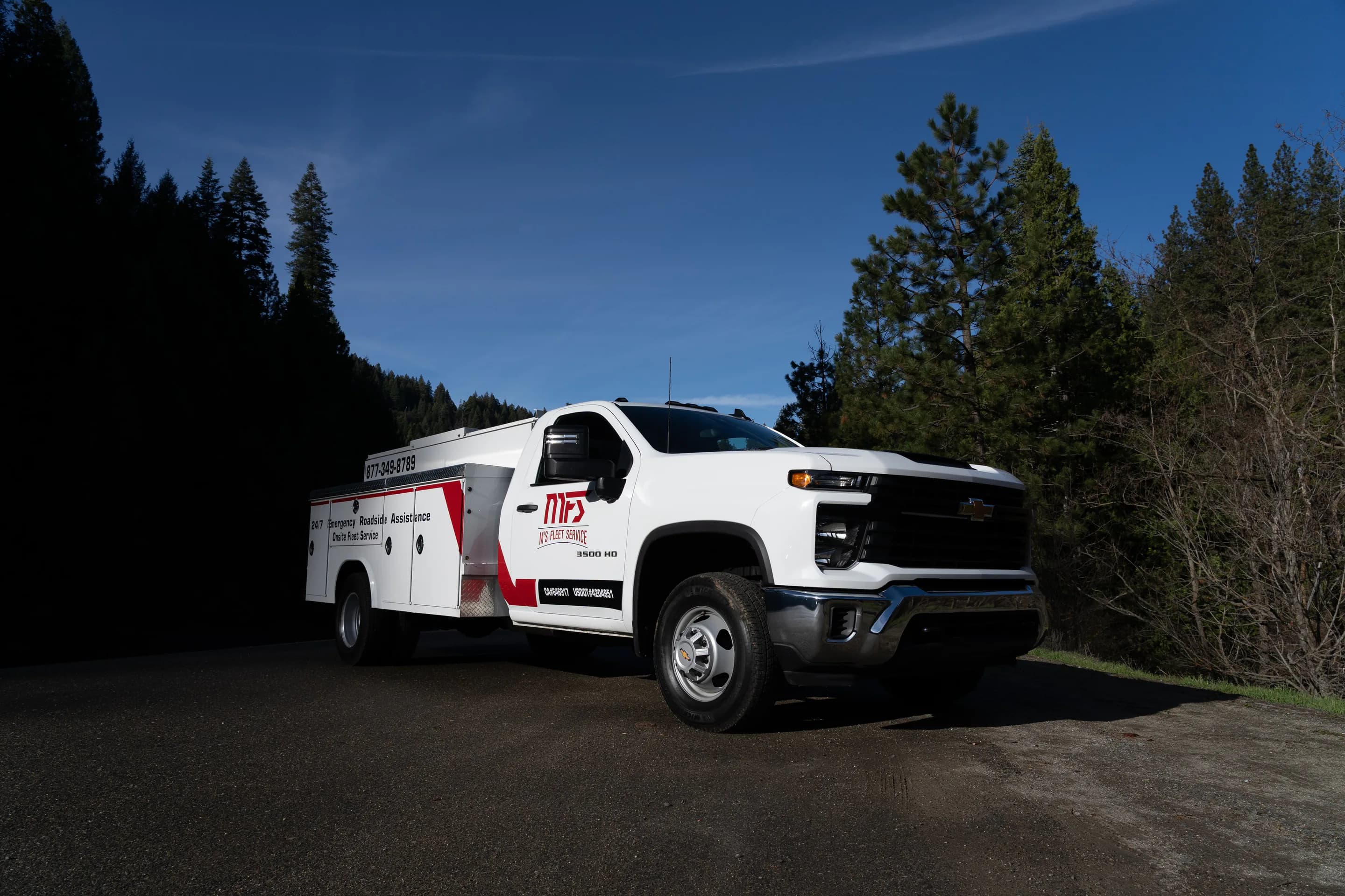 MFS service truck in the forest at dusk