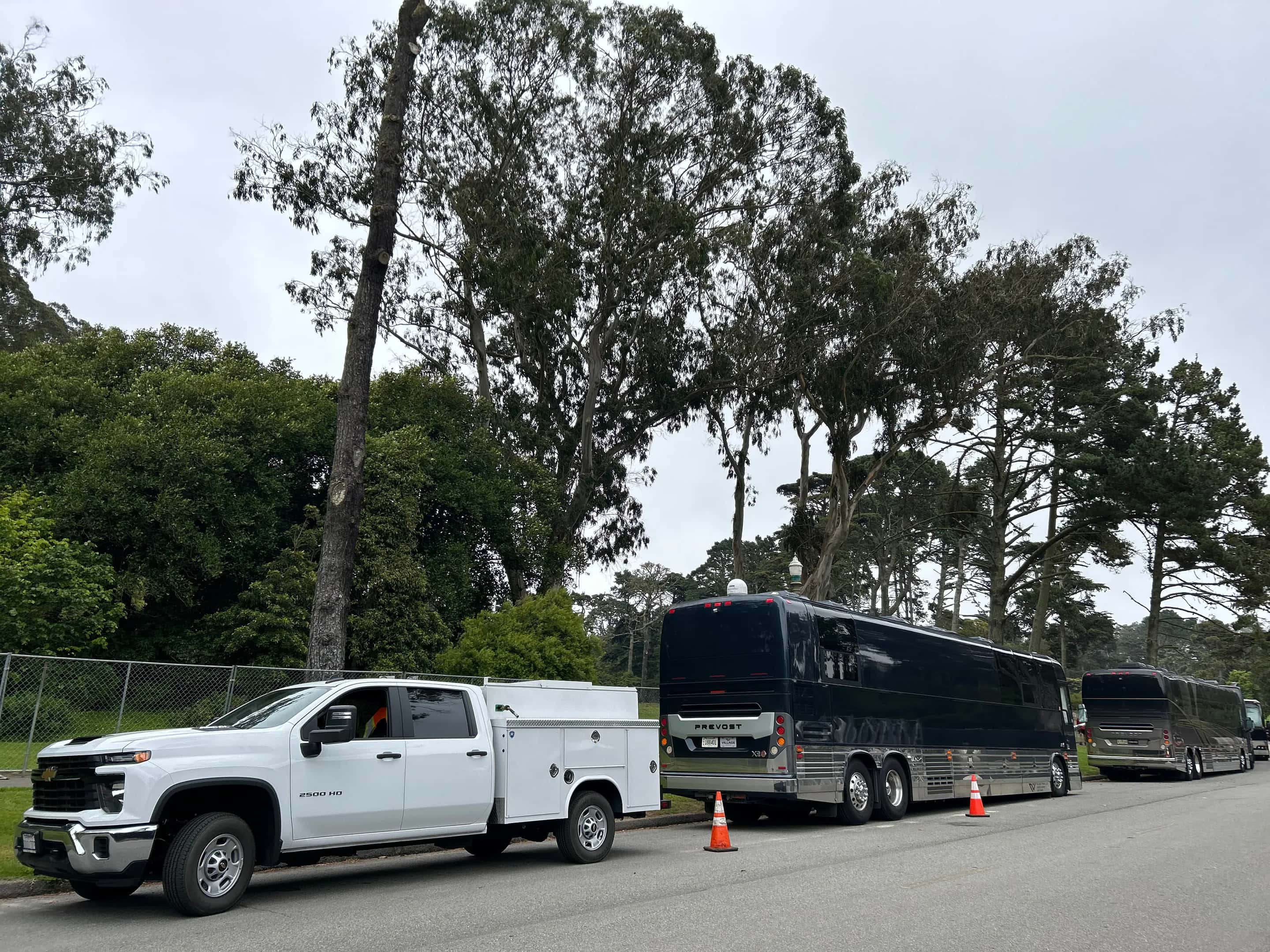 MFS Fleet Service truck parked beside a coach bus for on-site repair