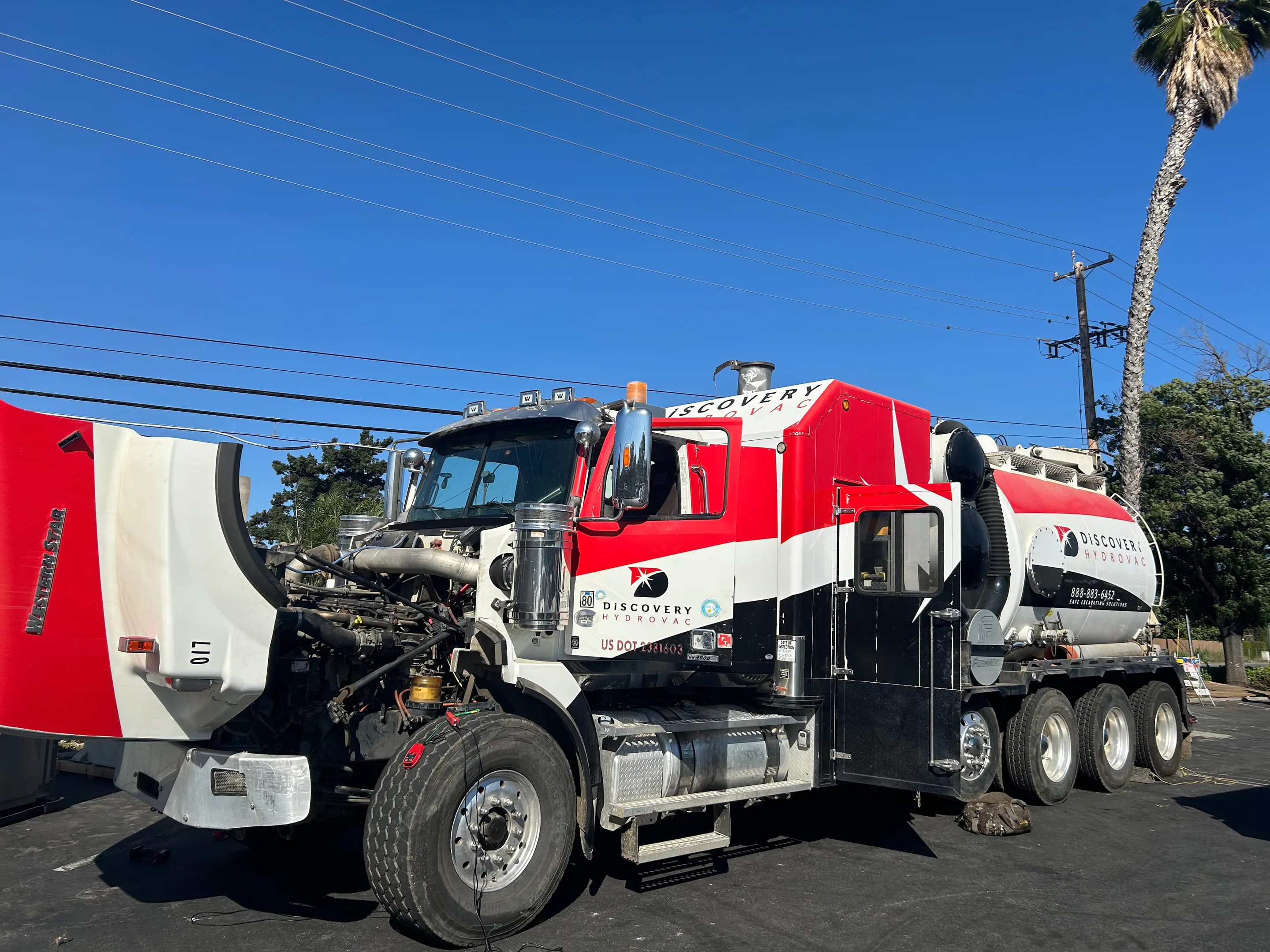 MFS technician repairing a heavy industrial truck on site